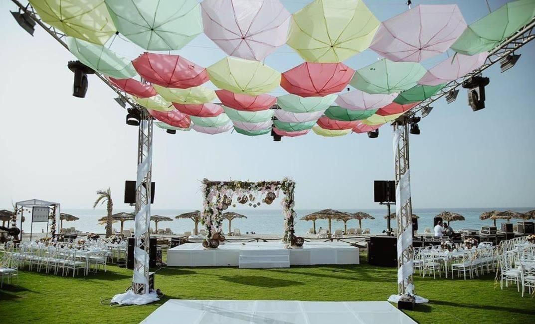 Borg El Arab Beach Resort Exterior foto A canopy of umbrellas