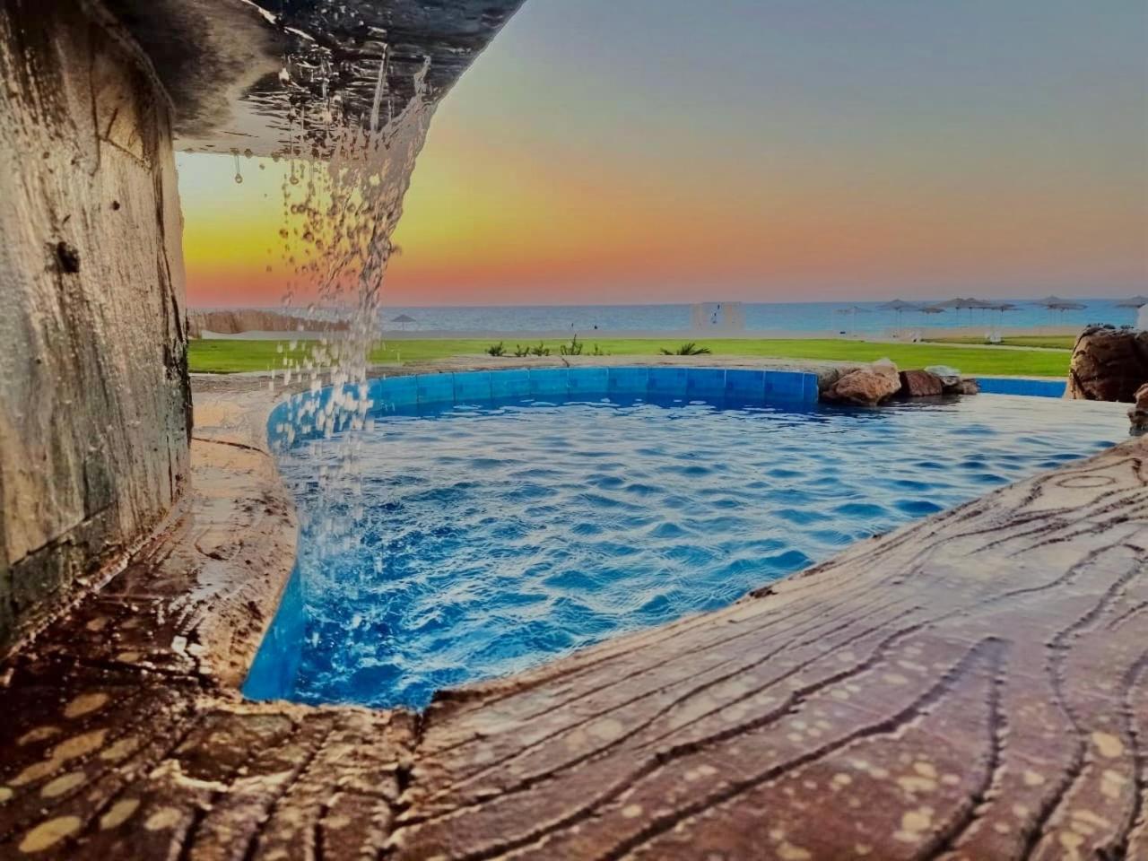 Borg El Arab Beach Resort Exterior foto Sunset at the beach